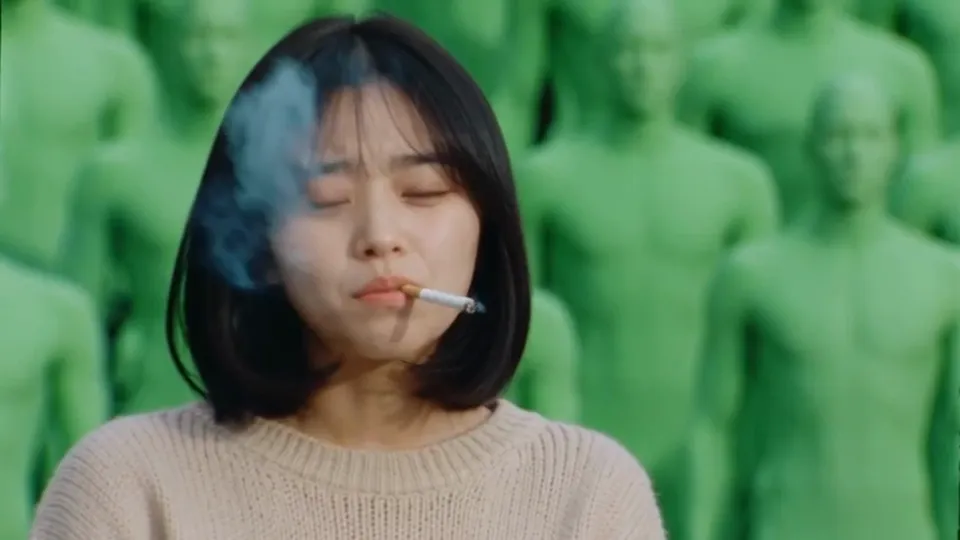 Input · The opening close-up. The smoke and the expression carry over.